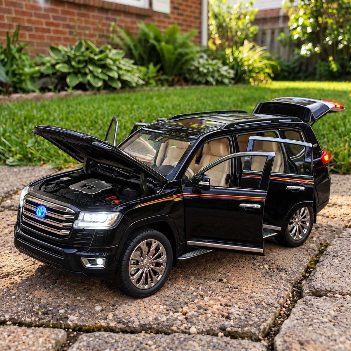 Black Toyota Land Cruiser LC300 diecast model with opening doors, bonnet and tailgate