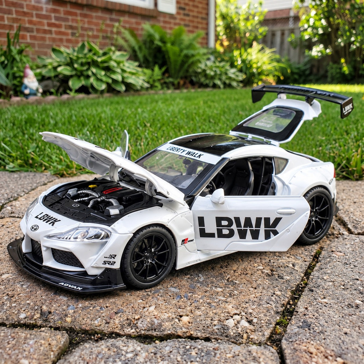 Toyota Supra MK5 Liberty Walk die-cast model with opening doors, bonnet and rear hatch showing the engine bay